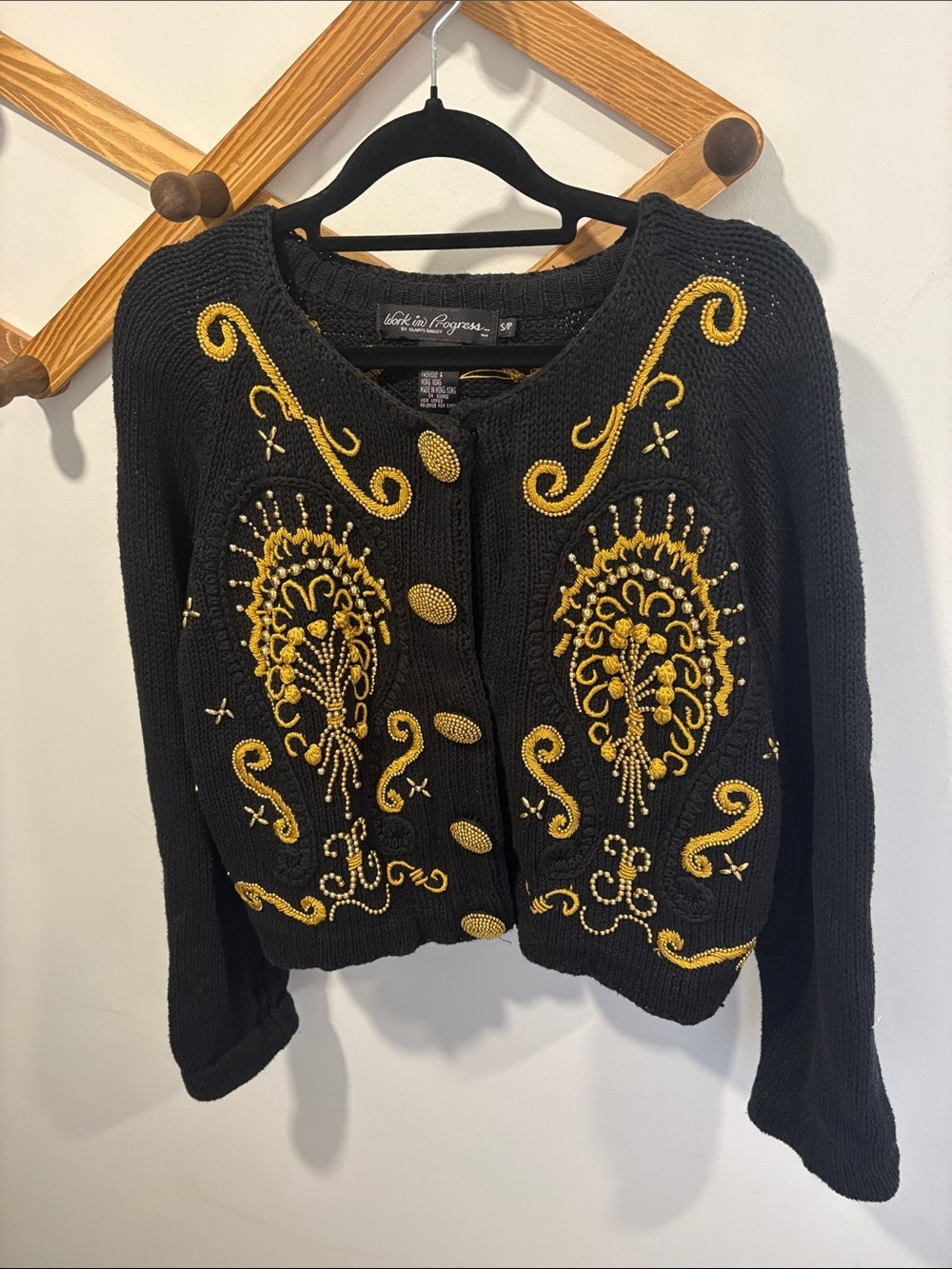 vintage black knit cropped cardigan by the brand Work in Progress Gladys Bagley